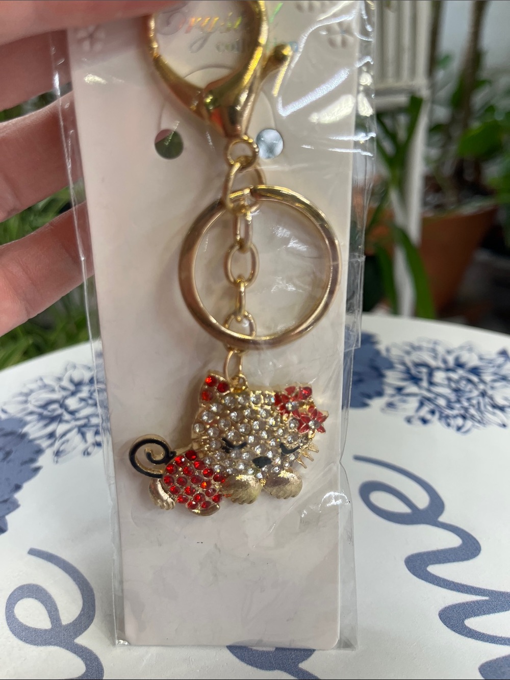 Gold-tone Crystal sleeping Cat Keychain with Red Accents